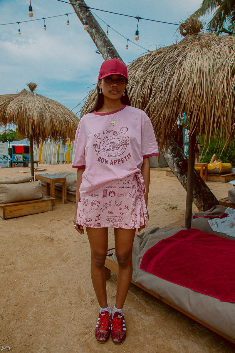 Pink tee shot on a beach from Palm Collective