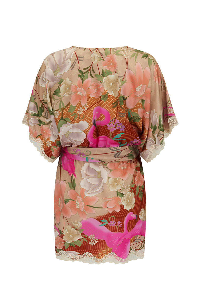 Floral dress with a pink belt on a white background