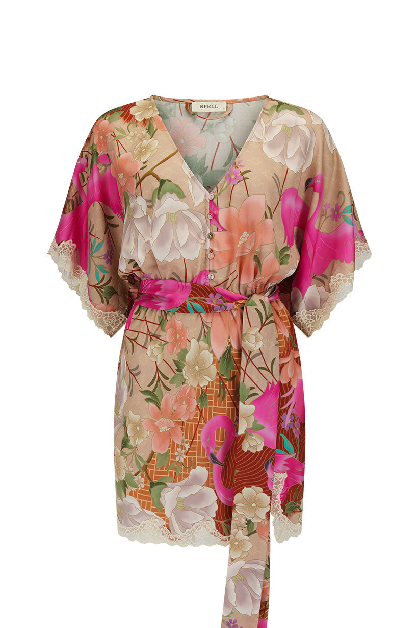 Floral patterned dress with a belt on a white background