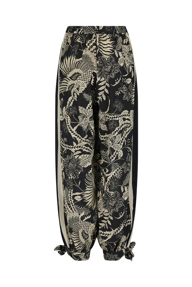 Tropical patterned pants on a white background