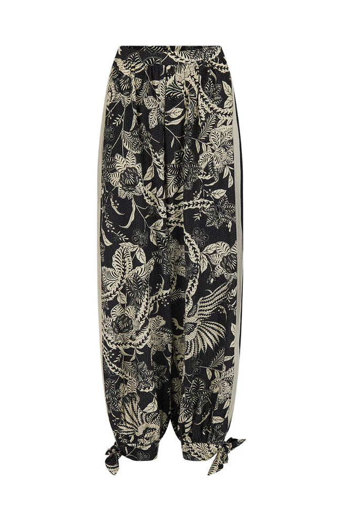 Black pants with a gold floral pattern on a white background