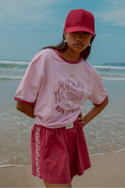 Pink shorts with contrast tape on sides