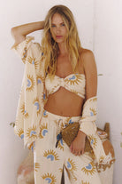 Woman in a stylish outfit with a white background