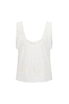 White sleeveless top with lace details on a white background