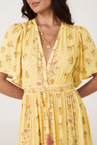 Yellow floral maxi dress with button through details and elasticated ties