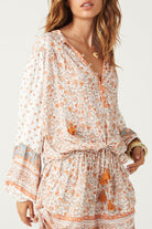 Sunshine Bandit Blouse in Desert Sage paired with blue wash jeans