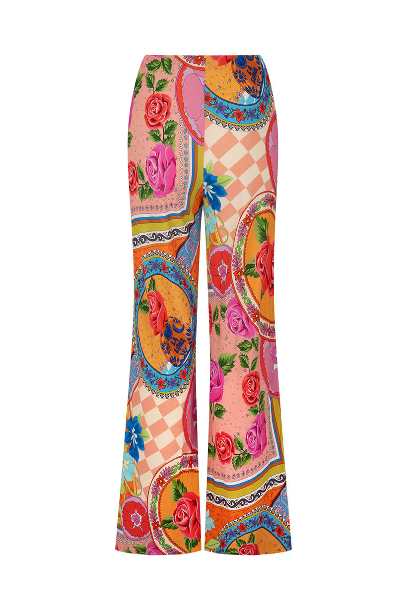 Colorful patterned pants with floral and decorative design on a white background