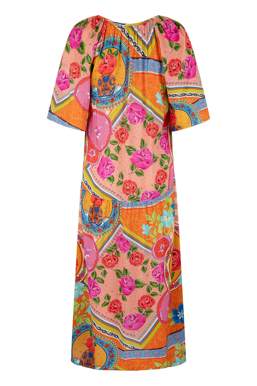 Colorful dress with floral and abstract patterns on a white background