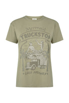 Khaki t-shirt with graphic design on a white background