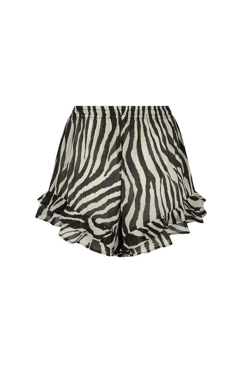 Zebra print shorts with ruffled hem on a white background