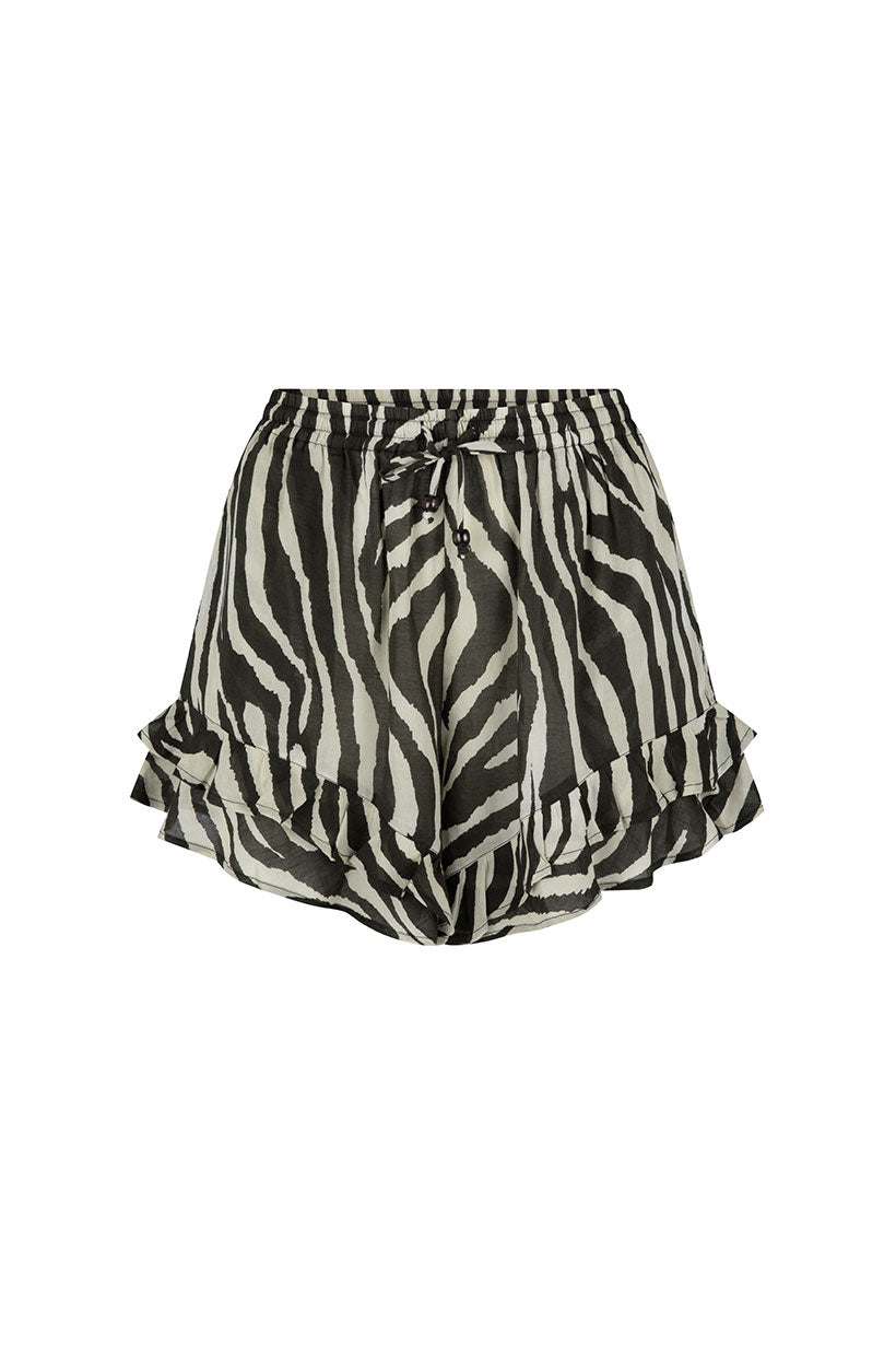 Zebra print shorts with ruffled hem on a white background