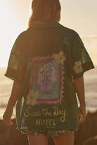 Blonde Woman Wearing the Seas the Day Shirt 