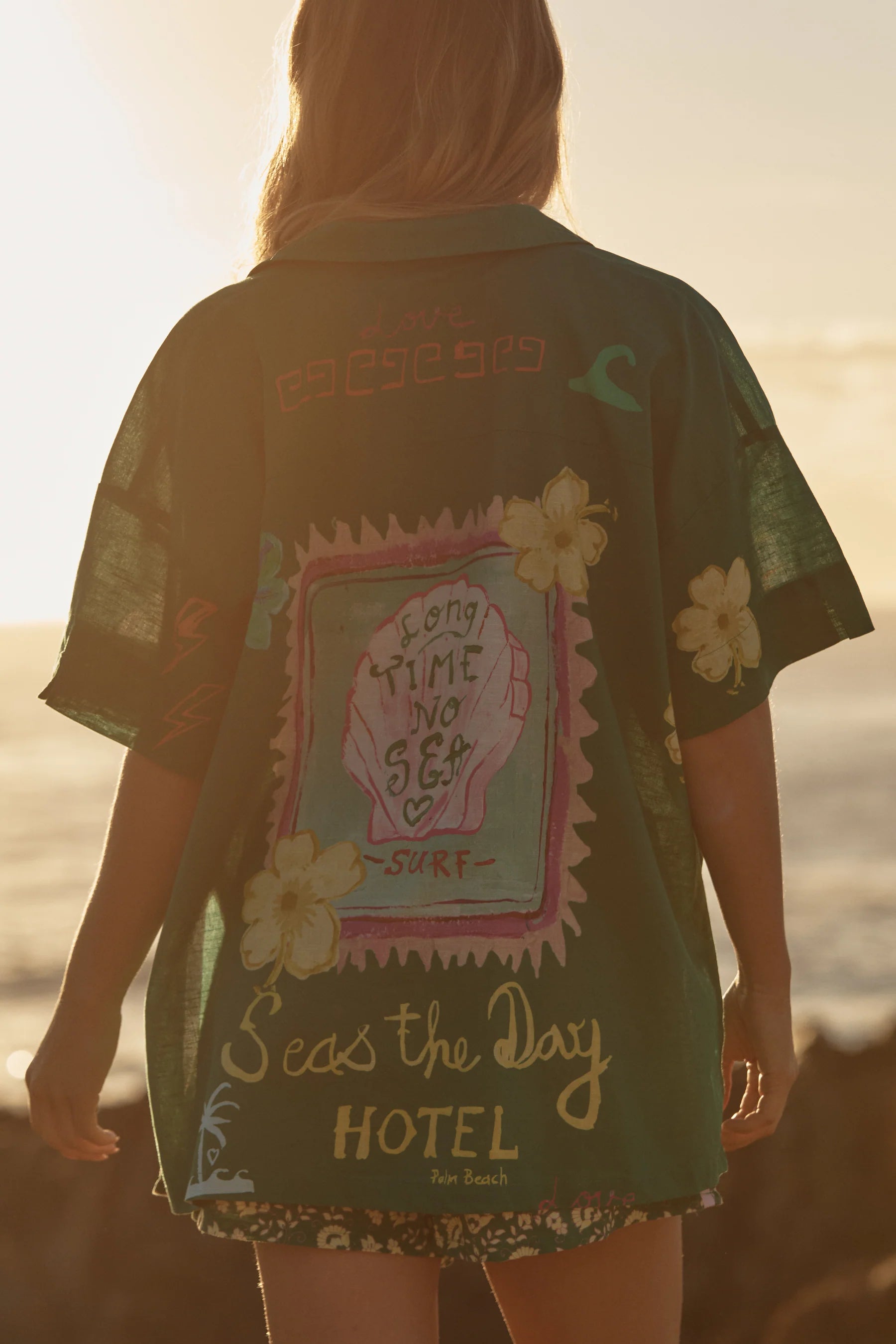 Blonde Woman Wearing the Seas the Day Shirt 