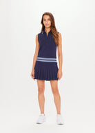 Navy blue tennis dress with button through and stand collar featuring a pleated skirt