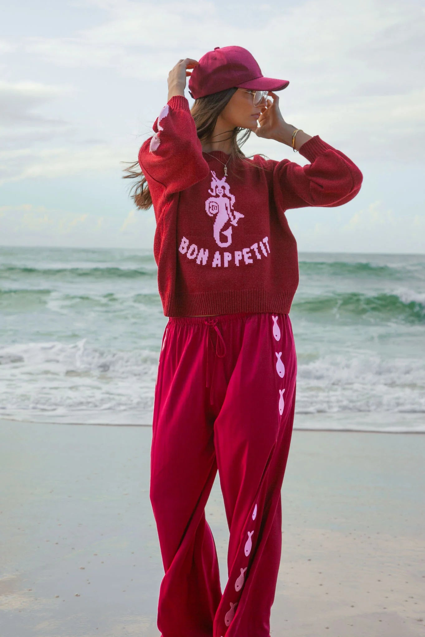 Deep red pants from Palm Collective with embroidered fish down the sides. 