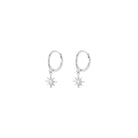 Pair of silver hoop earrings with star-shaped drops on a white background
