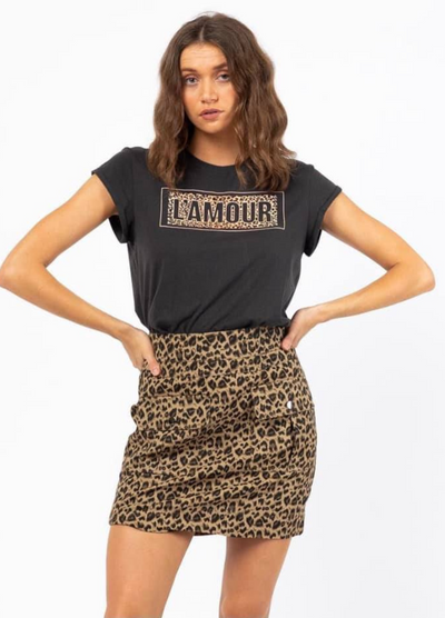 Model wearing black l'amour logo tee with animal print design