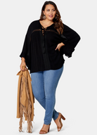 Woman wearing black boho blouse