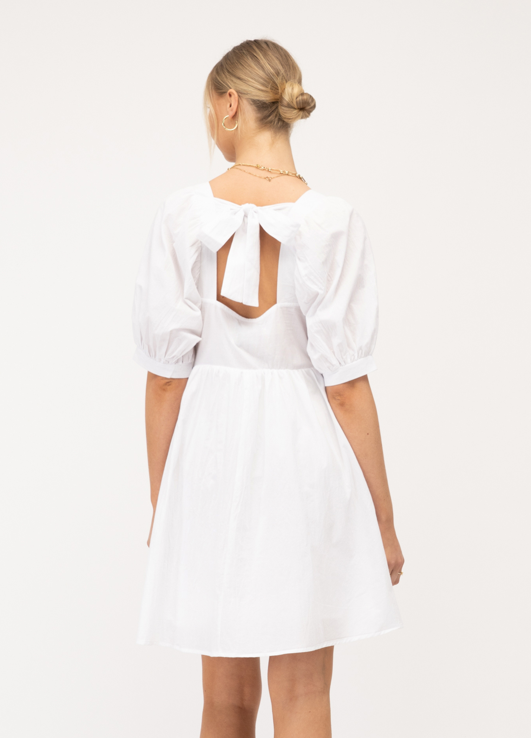 Model wearing Paper Heart white Sonia dress with pockets