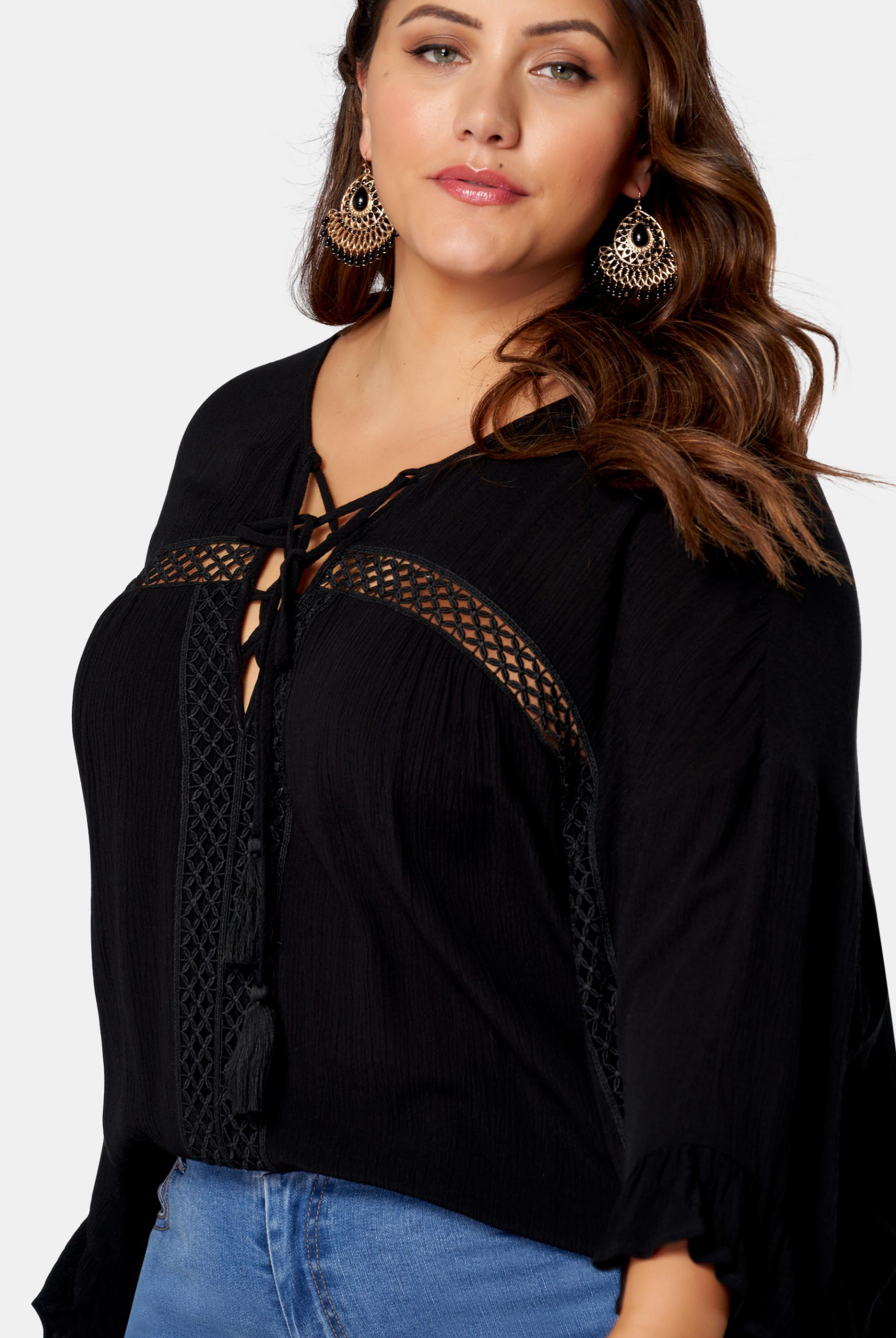 Woman wearing black boho blouse