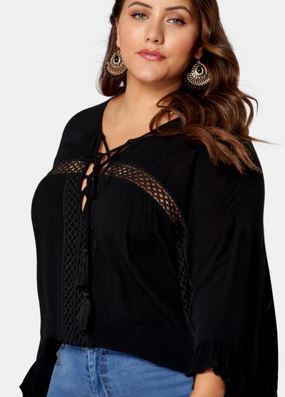 Woman wearing black boho blouse
