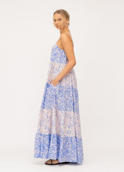 Model wearing tiered Livia Maxi Dress in blue and white mixed media print