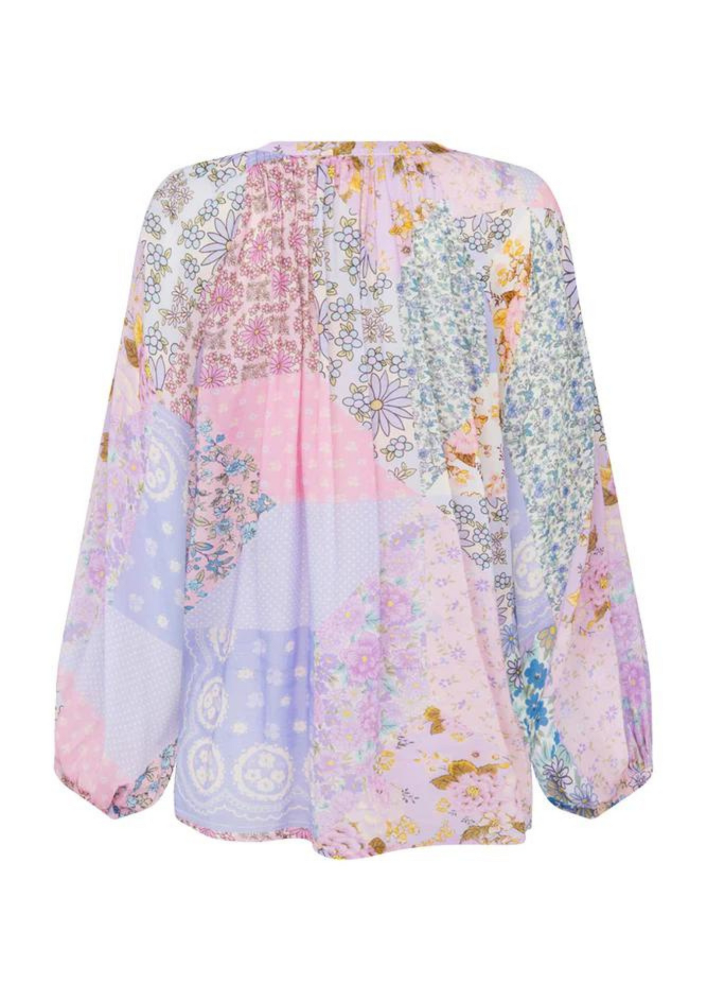 Model wearing the Spell Cha Cha Blouse in Pastel patchwork jacaranda print