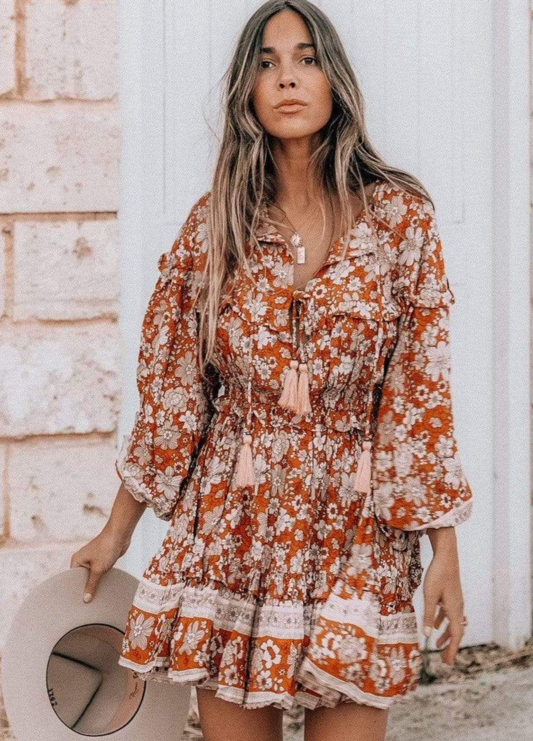 Model wearing floral print boho mini dress