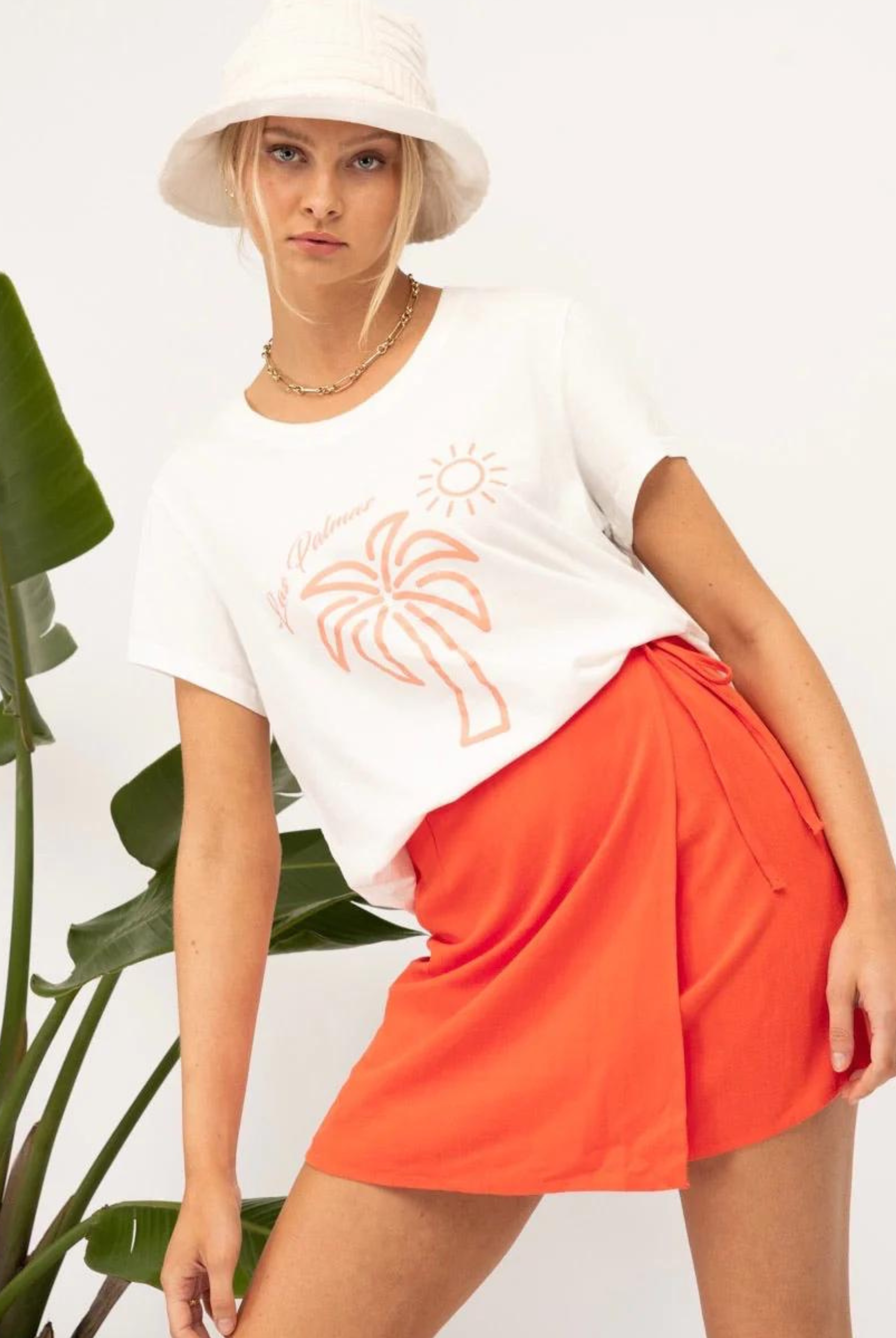 White tee with orange palm tree motif