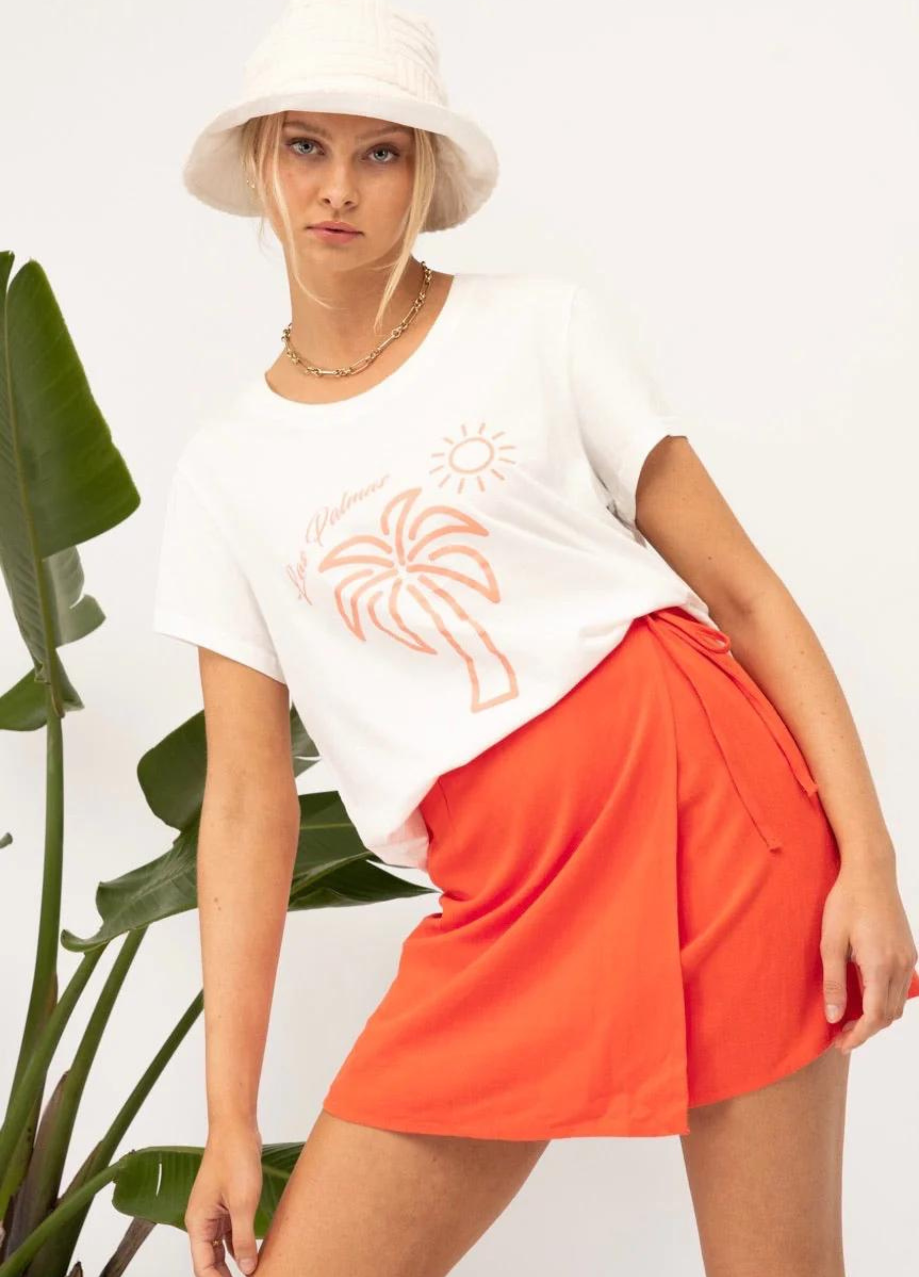 White tee with orange palm tree motif