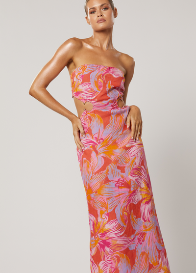 Model wearing the Avalyn Printed Maxi Dress with cut outs and strapless neckline