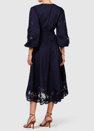 Model wearing navy blue midi dress from ministry of style
