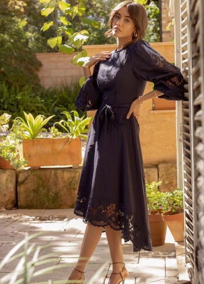 Model wearing navy blue midi dress from ministry of style