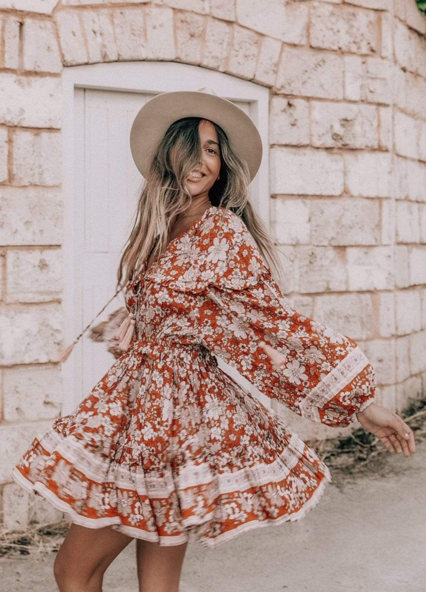 Model wearing floral print boho mini dress