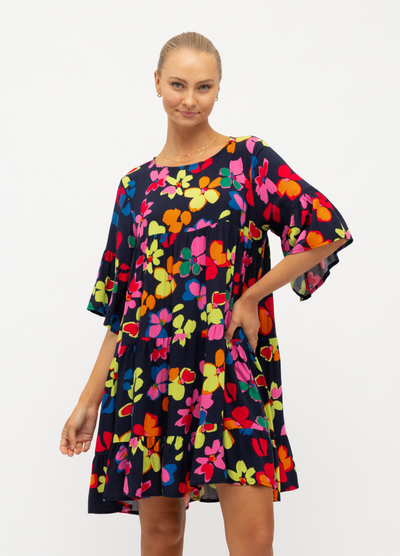 Model wearing the bright floral Addison Dress