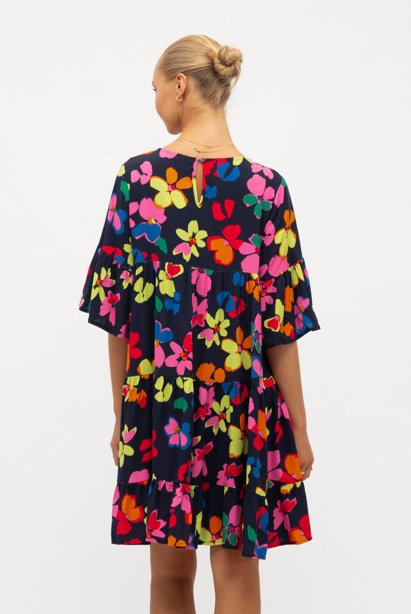 Model wearing the bright floral Addison Dress