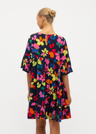 Model wearing the bright floral Addison Dress
