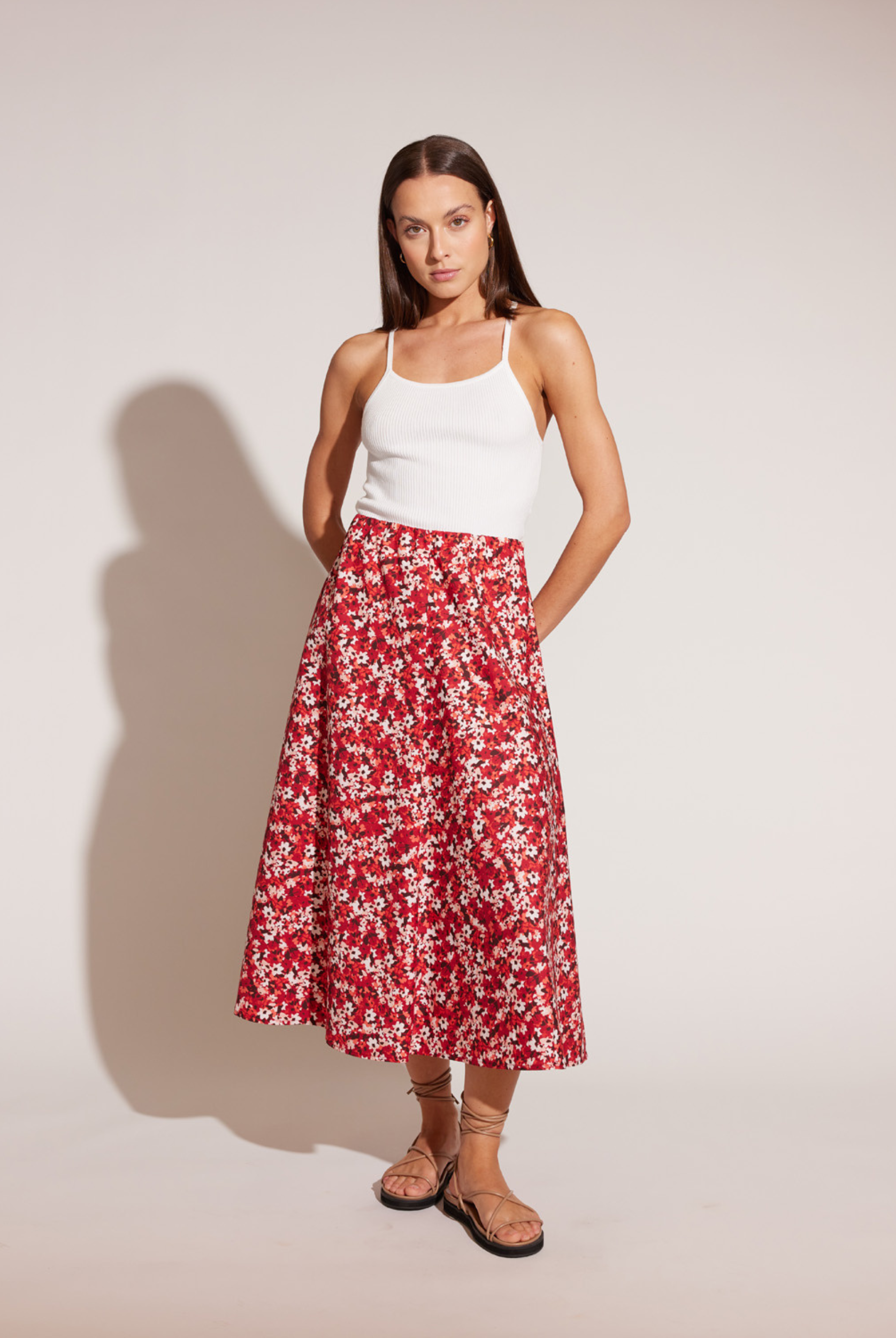 Model wearing red floral print bias cut Midi Skirt in red ditzy floral