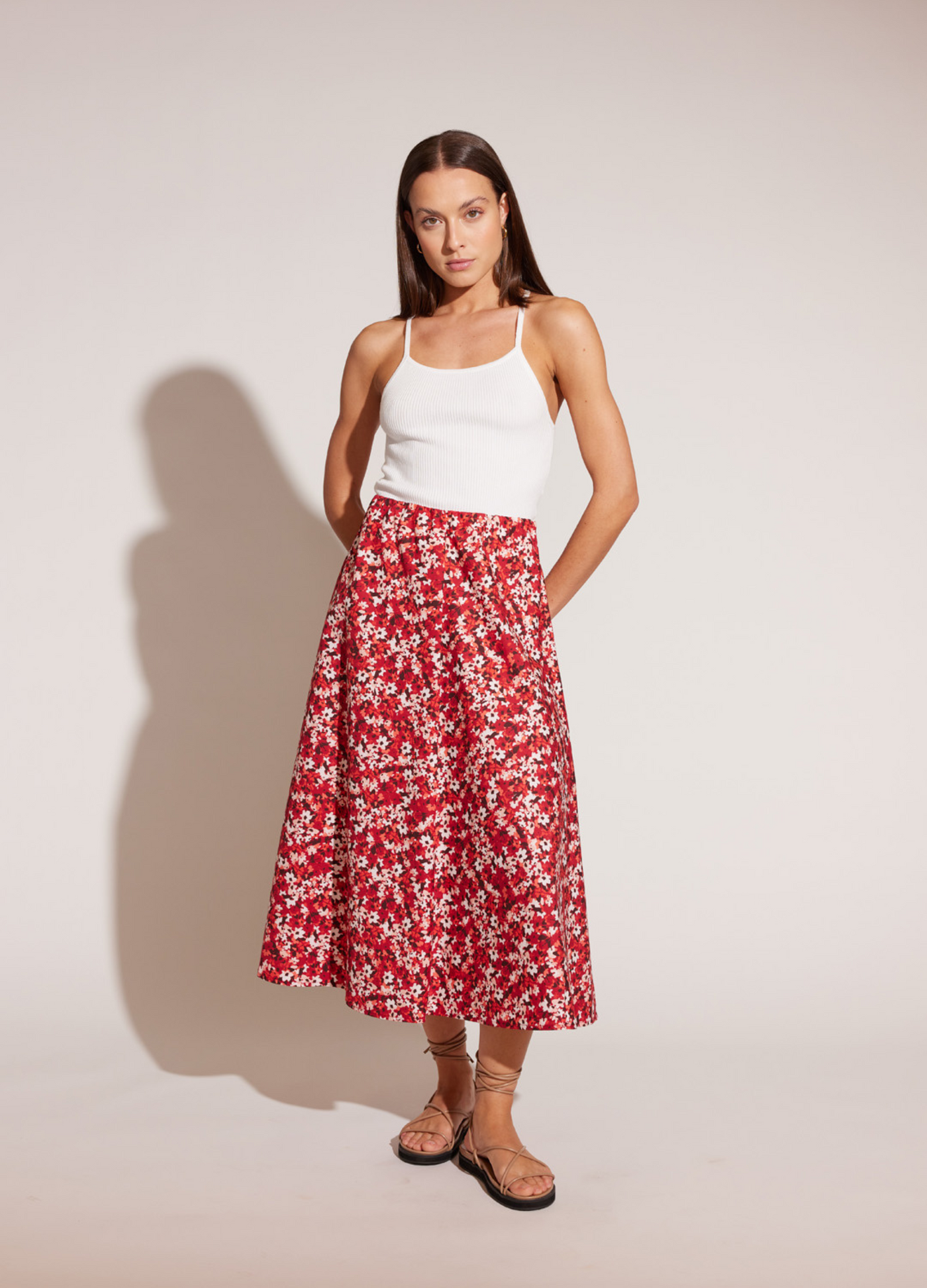 Model wearing red floral print bias cut Midi Skirt in red ditzy floral