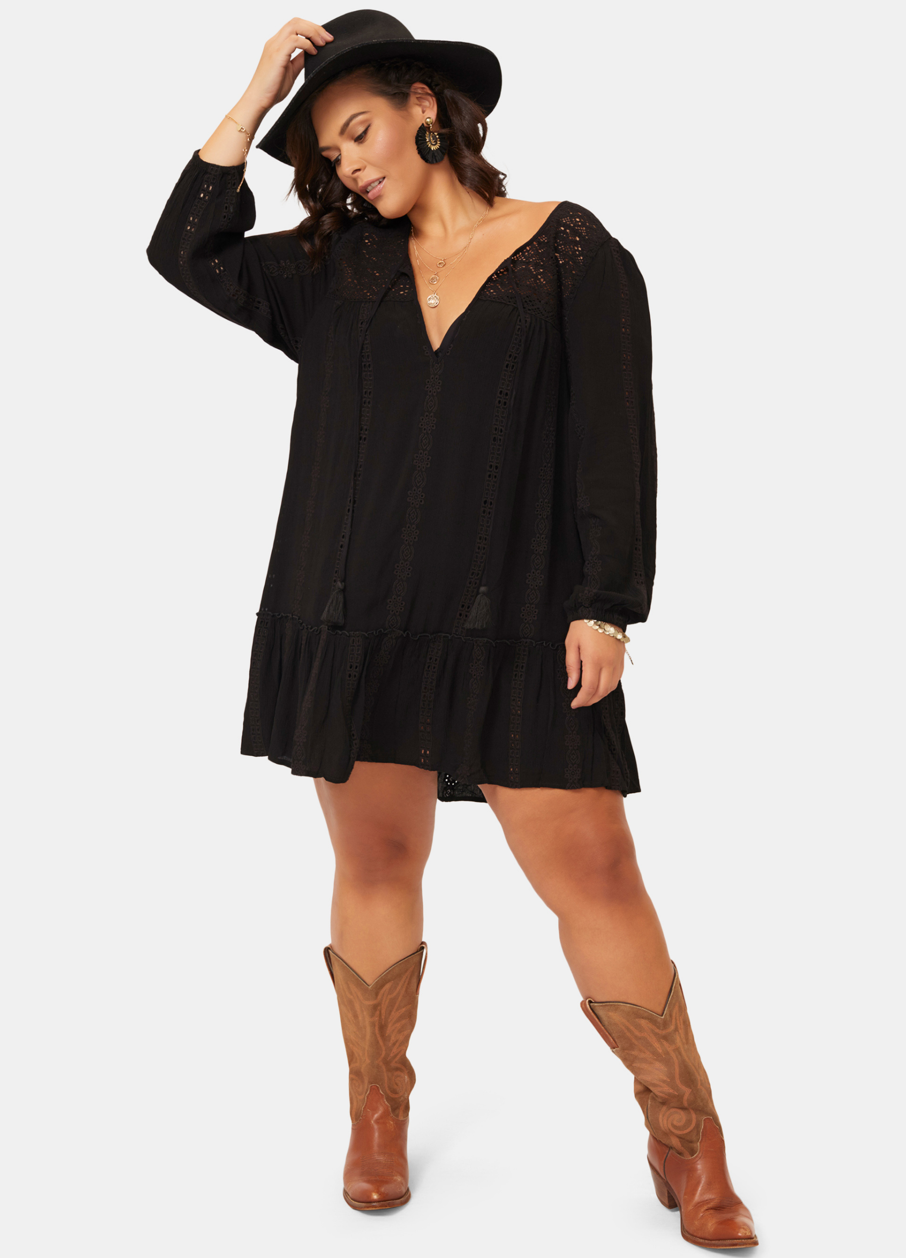 Woman wearing black lace detail boho mini dress