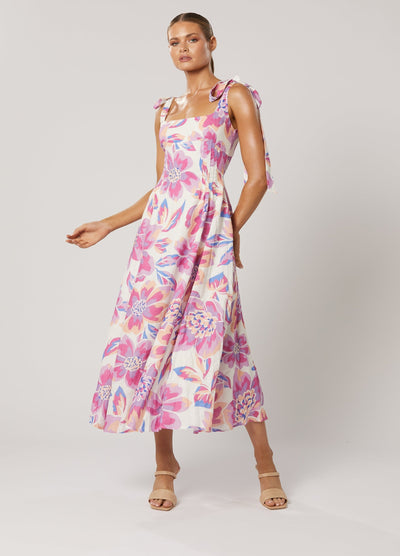 Model wearing the Audra Midi Dress - pink floral print midi with tie straps