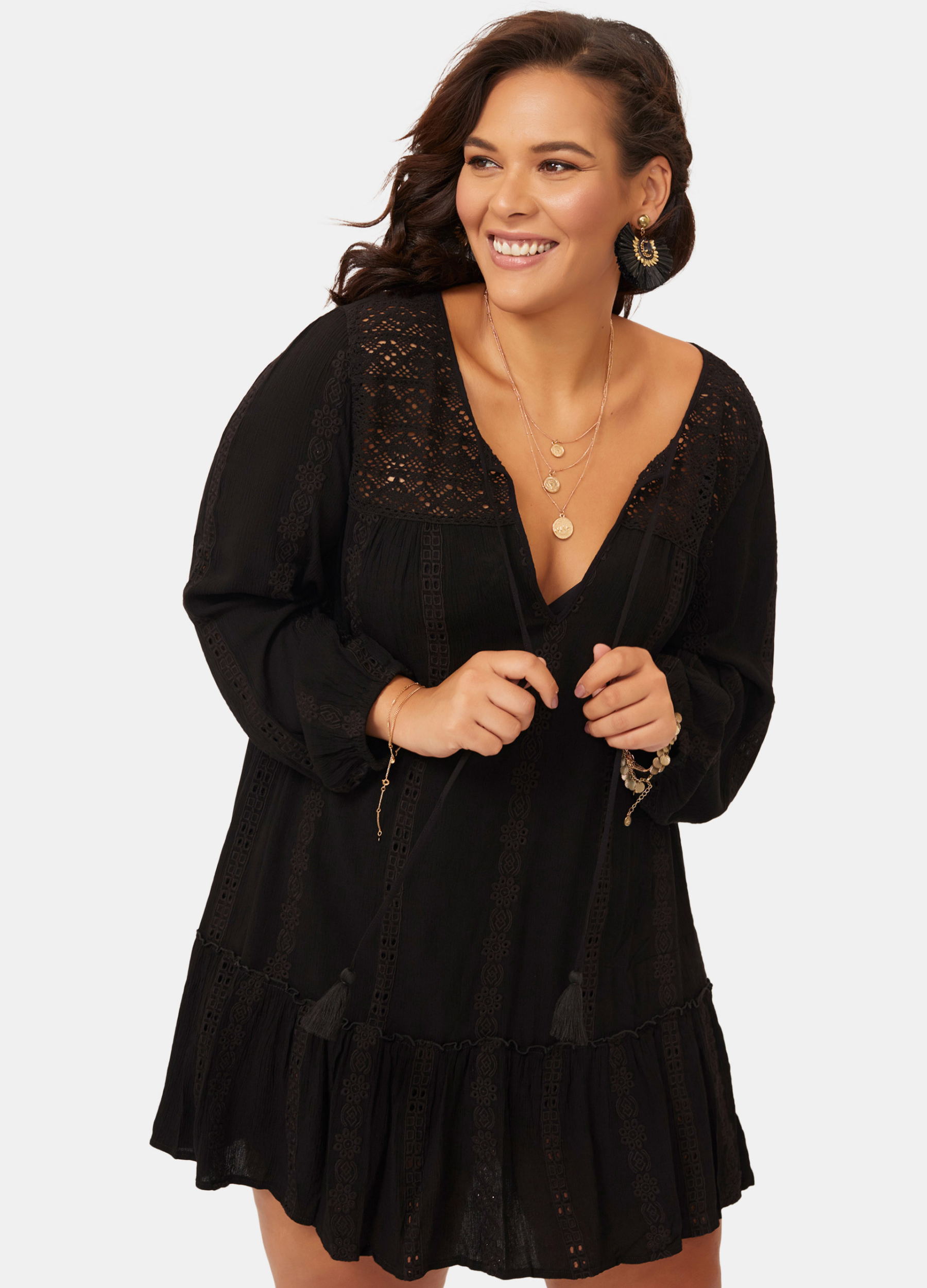 Woman wearing black boho detail curve fit mini dress