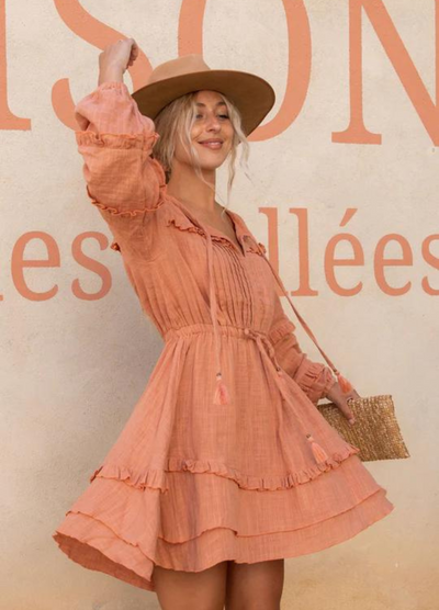 Short length cotton mini dress with pintucks and ruffles and a long sleeve you can gather up