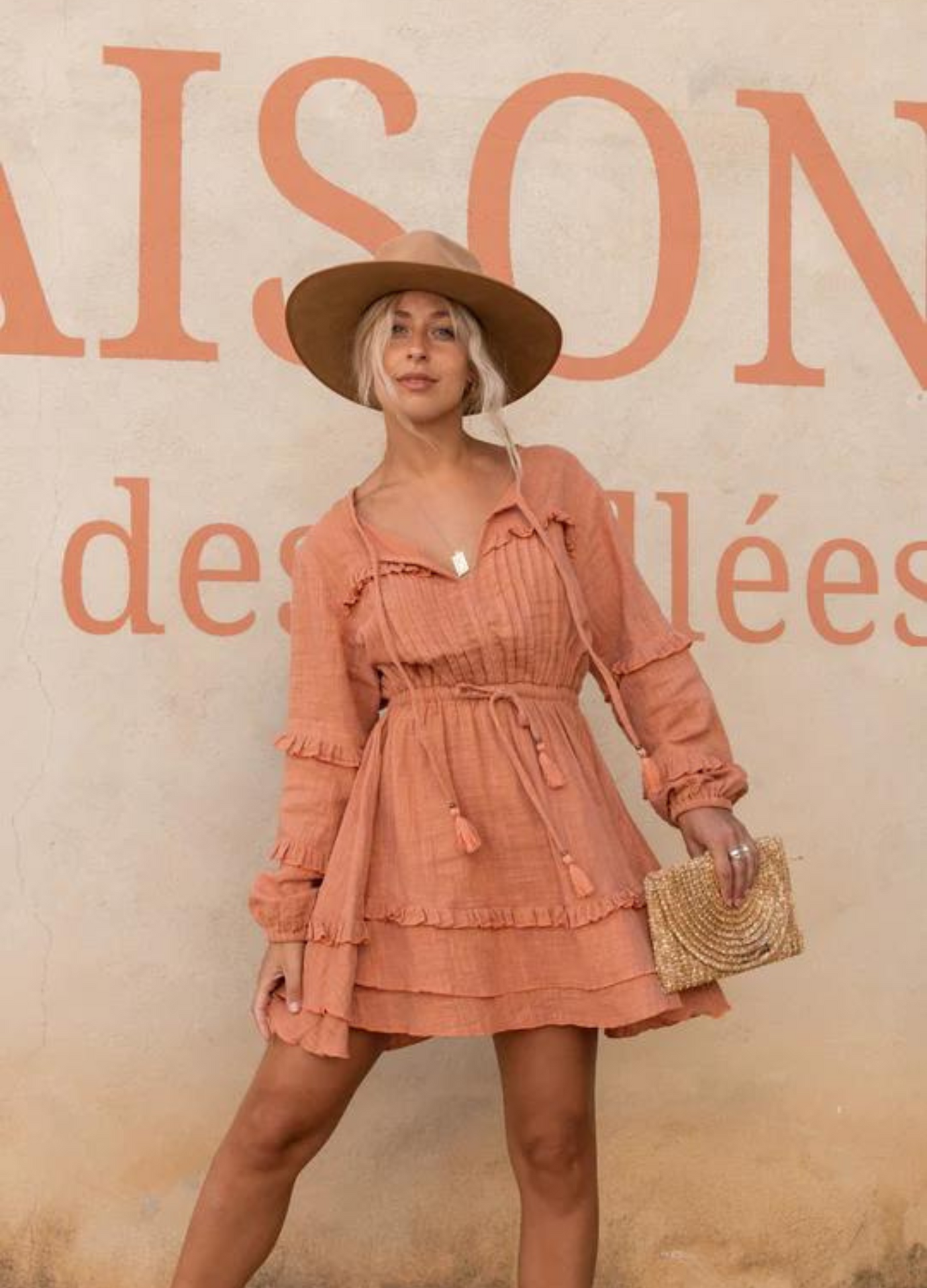 Short length cotton mini dress with pintucks and ruffles and a long sleeve you can gather up
