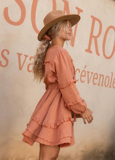 Short length cotton mini dress with pintucks and ruffles and a long sleeve you can gather up