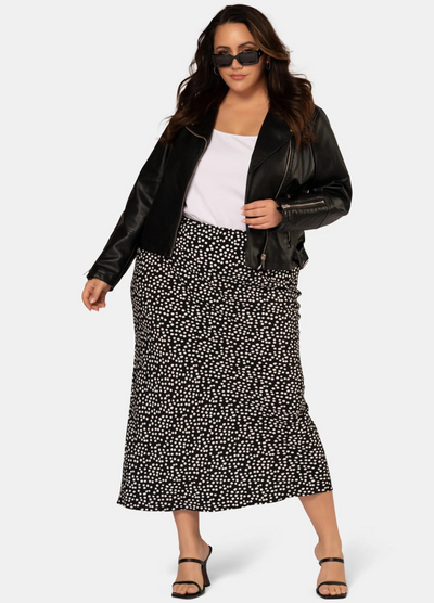 Model wearing the black and white spot print midi skirt in viscose crepe