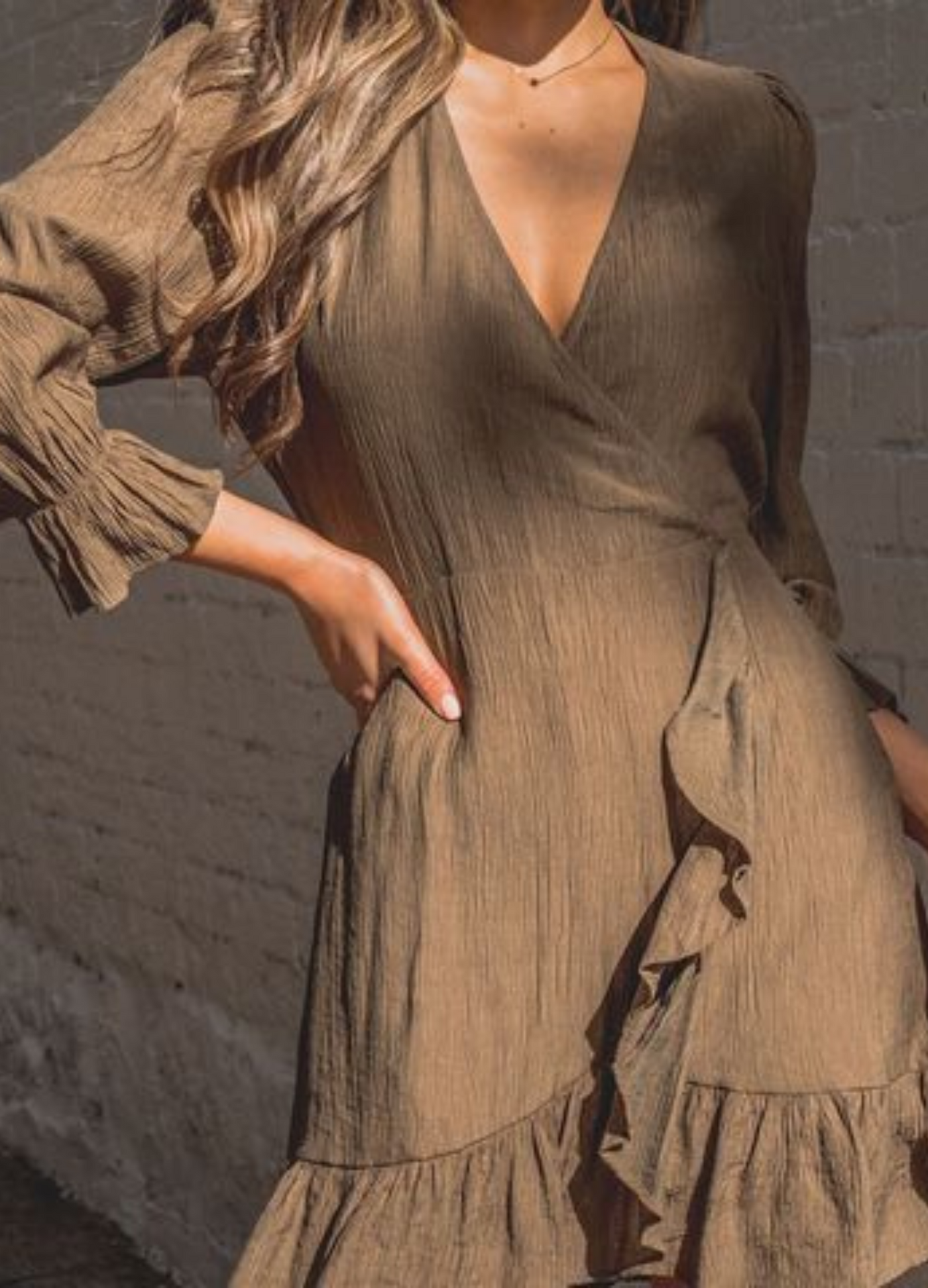 Model wearing a khaki green wrap dress