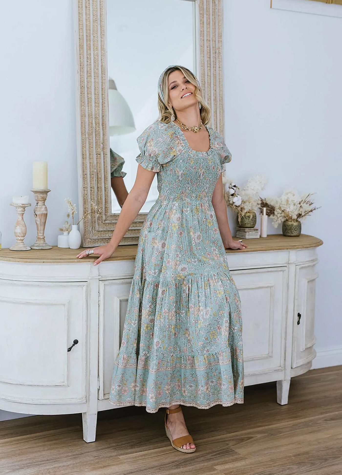 Model wearing the house of skye Daisy Belle dress in floral print with shirred bust and puff sleeve