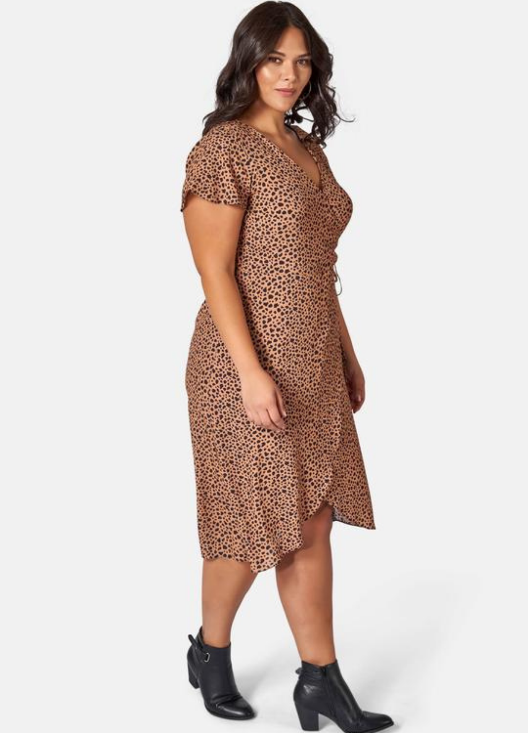 Brunette Woman wearing animal print wrap dress