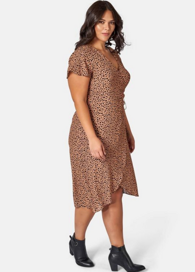 Brunette Woman wearing animal print wrap dress